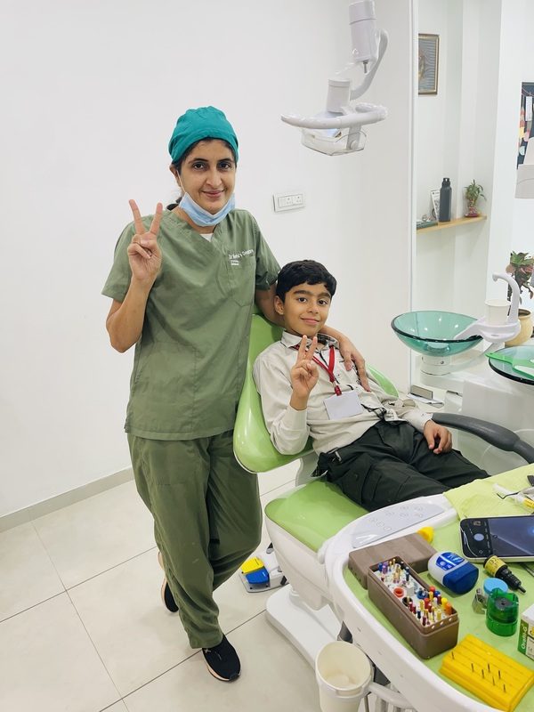 Dr. Neetu Tanwani treating a patient at REAL PEARL DENTAL CARE, Thaltej, Ahmedabad